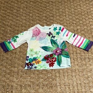 Catimini baby long sleeve top beautiful flower pattern in a size 6 months.